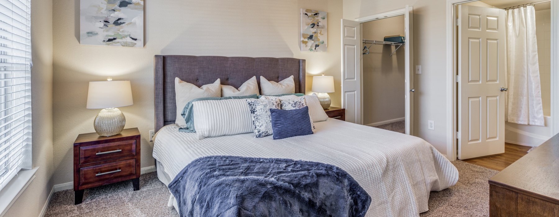 a bedroom with a bed and a fan