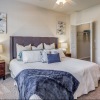 a bedroom with a bed and two nightstands